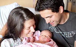 New parents at the hospital with their newborn